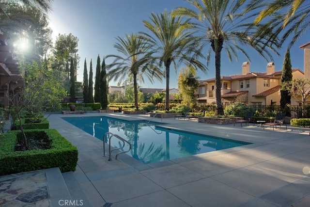 view of swimming pool featuring a patio area