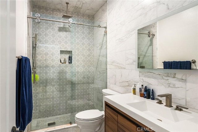 bathroom featuring toilet, a shower with shower door, tasteful backsplash, tile walls, and vanity