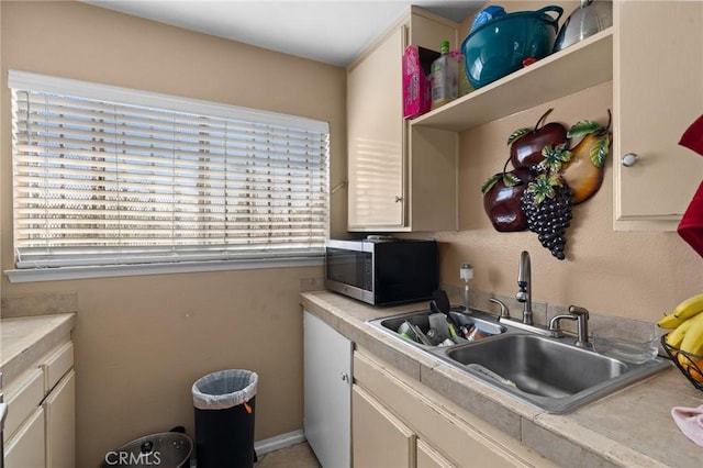 kitchen featuring sink and cream cabinets