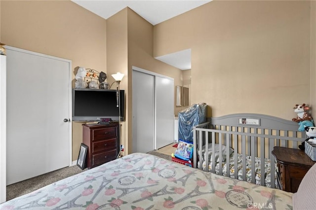 carpeted bedroom with a closet