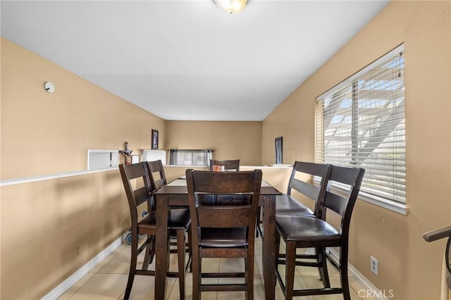 dining area featuring light tile patterned floors