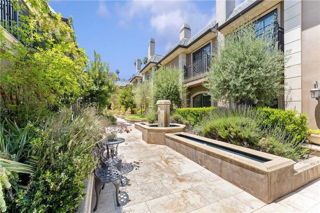 surrounding community featuring a patio area