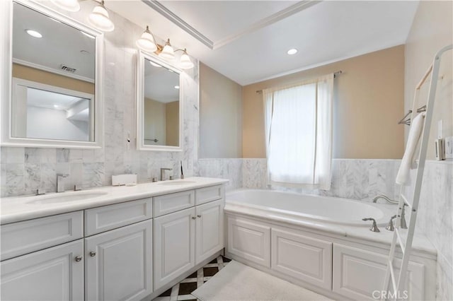 bathroom featuring a tub to relax in and vanity