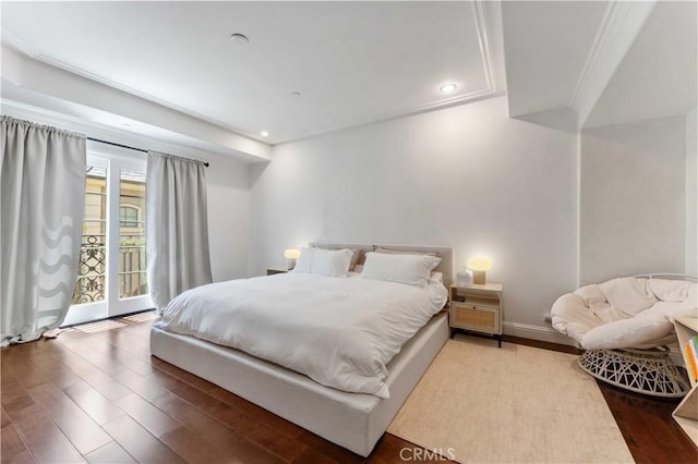 bedroom featuring hardwood / wood-style flooring and access to exterior