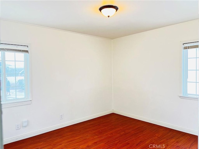 empty room with wood-type flooring