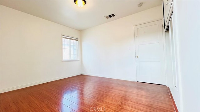 unfurnished room with light hardwood / wood-style floors