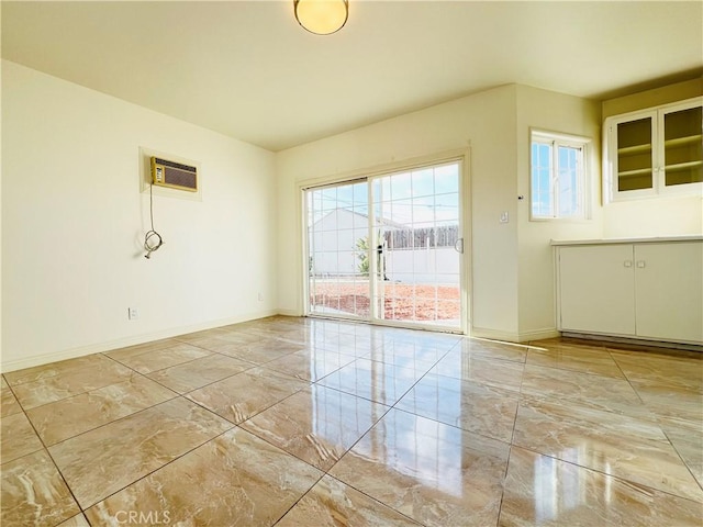 empty room featuring a wall mounted air conditioner