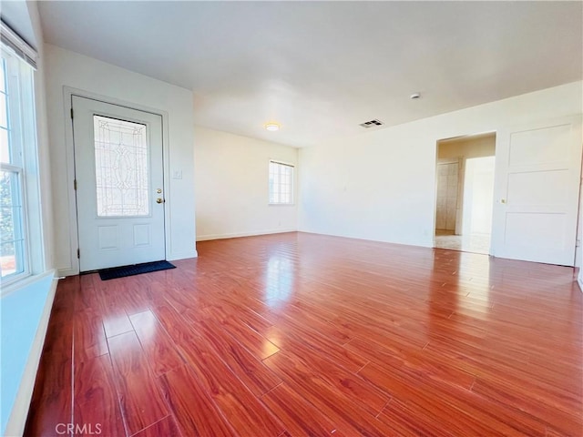 entryway with hardwood / wood-style floors