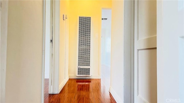 hallway with wood-type flooring