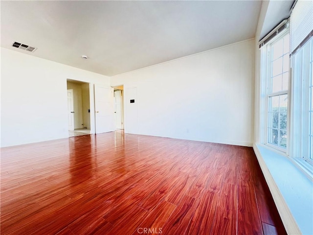 spare room with wood-type flooring