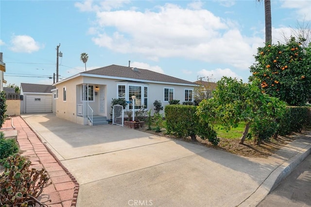 view of front of property with an outbuilding and a garage