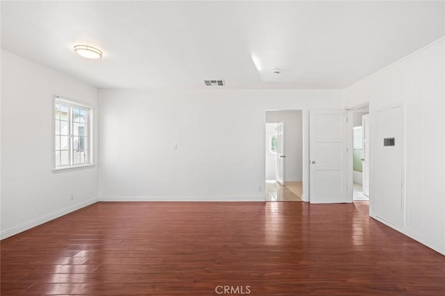 unfurnished room featuring dark hardwood / wood-style flooring