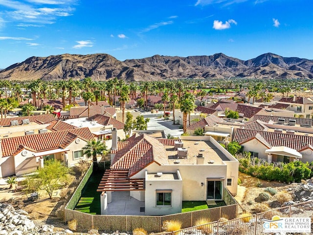 birds eye view of property featuring a mountain view