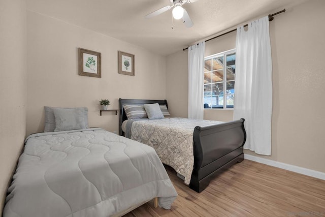 bedroom featuring ceiling fan and light hardwood / wood-style floors