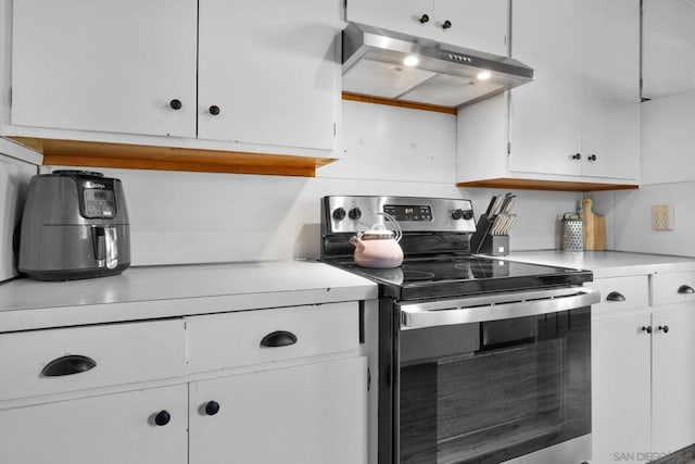 kitchen featuring white cabinetry and stainless steel electric stove