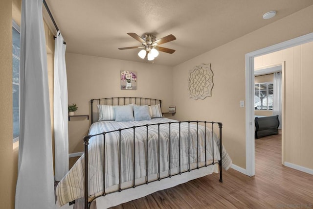 bedroom featuring ceiling fan and wood-type flooring