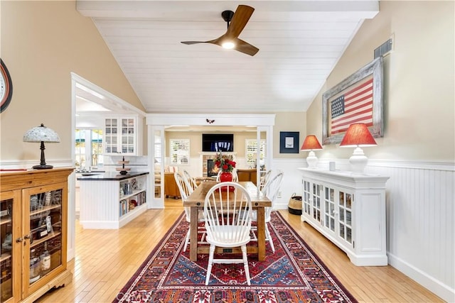 dining space featuring lofted ceiling, ceiling fan, wooden ceiling, and light hardwood / wood-style floors