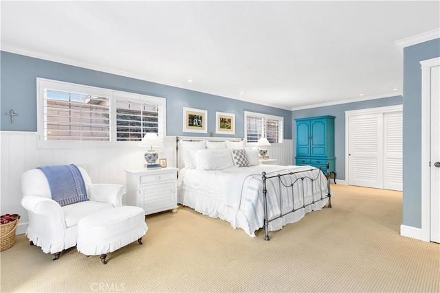 carpeted bedroom featuring crown molding