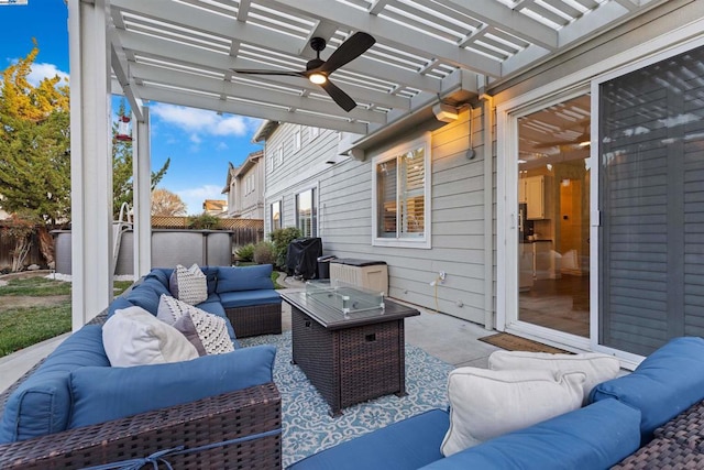 view of patio / terrace featuring ceiling fan, an outdoor living space with a fire pit, and a pergola