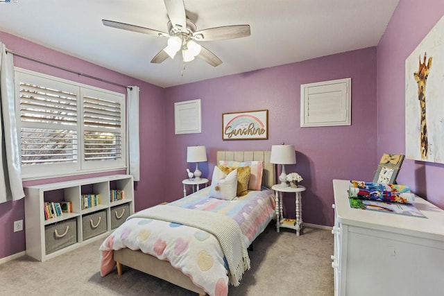 bedroom with ceiling fan and light colored carpet