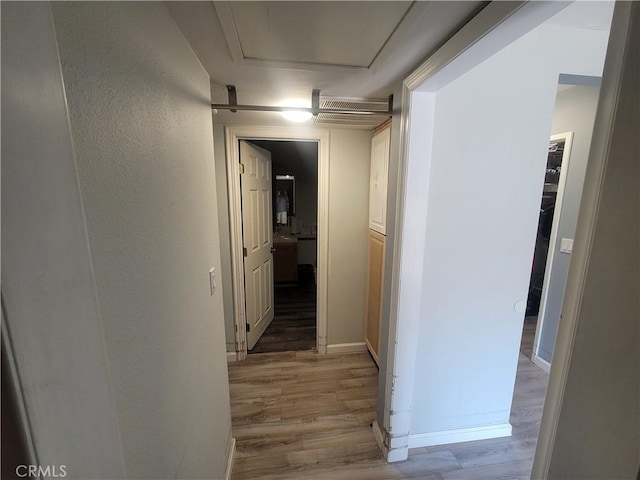 corridor featuring light hardwood / wood-style flooring