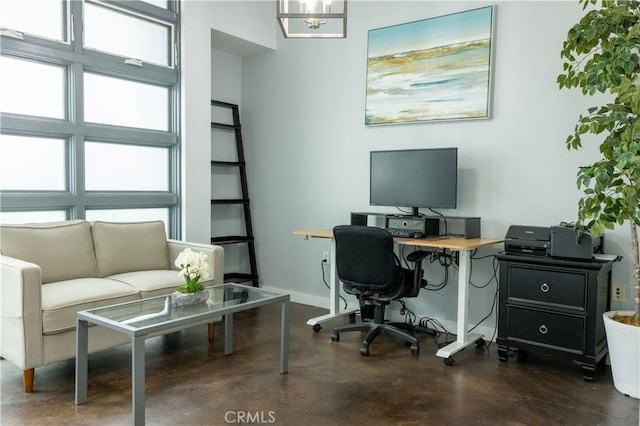 office space featuring an inviting chandelier