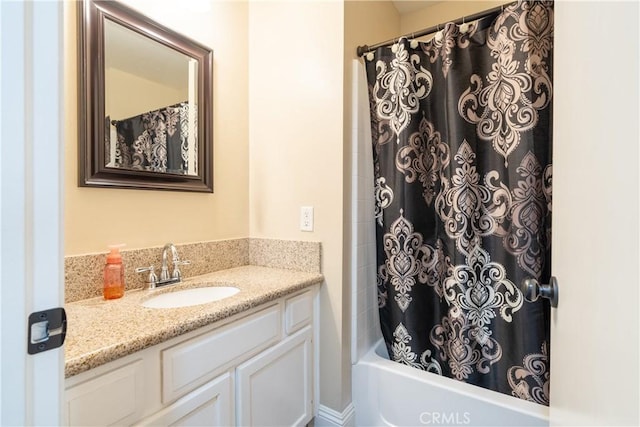 bathroom with vanity and shower / tub combo with curtain