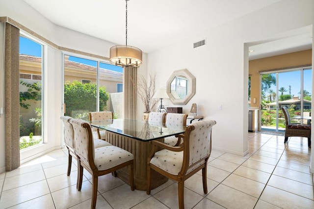 dining area featuring light tile patterned flooring