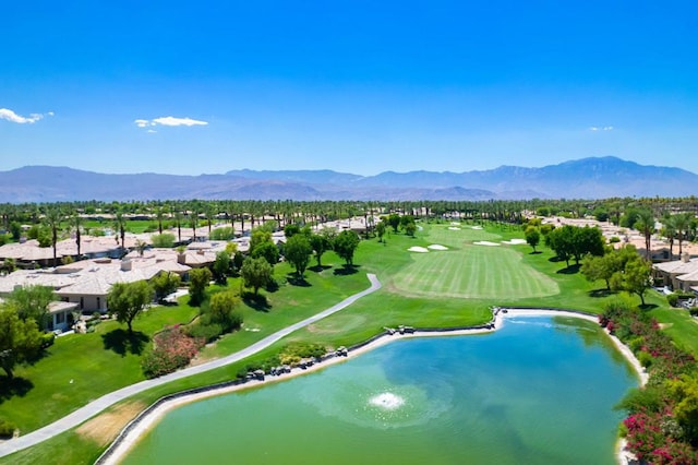 view of swimming pool featuring a water and mountain view