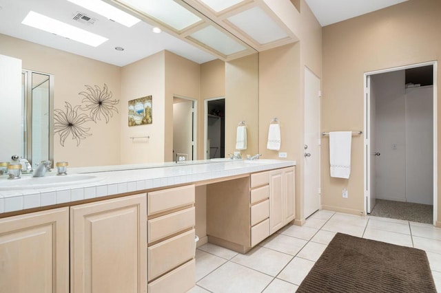 bathroom with vanity and tile patterned floors