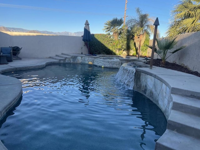 view of pool with pool water feature