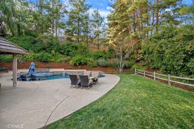 view of yard featuring a fenced in pool and a patio