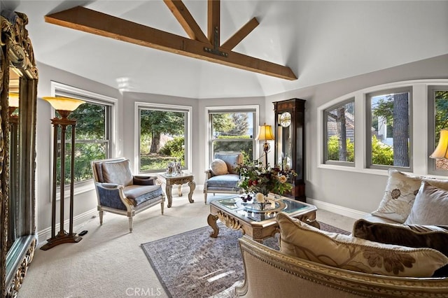 sunroom with vaulted ceiling with beams and a healthy amount of sunlight