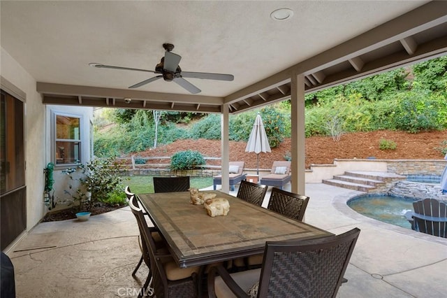 view of patio featuring ceiling fan