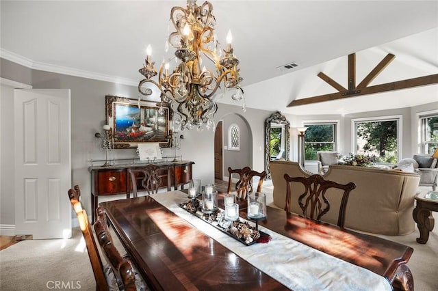 carpeted dining area with lofted ceiling and a notable chandelier