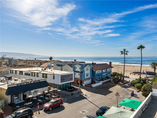 bird's eye view with a water view and a view of the beach