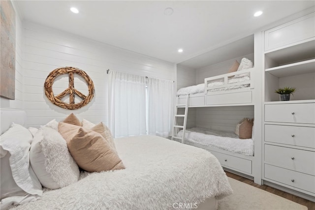 bedroom with hardwood / wood-style flooring