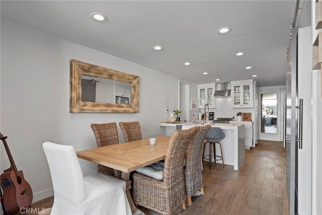 dining space featuring dark hardwood / wood-style flooring