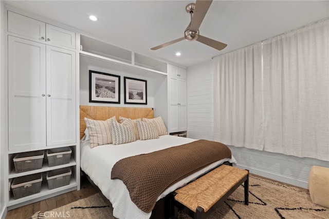 bedroom with hardwood / wood-style floors and ceiling fan