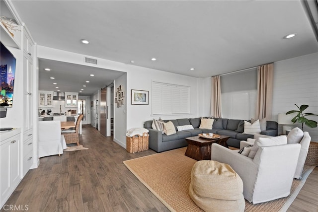 living room with dark hardwood / wood-style flooring