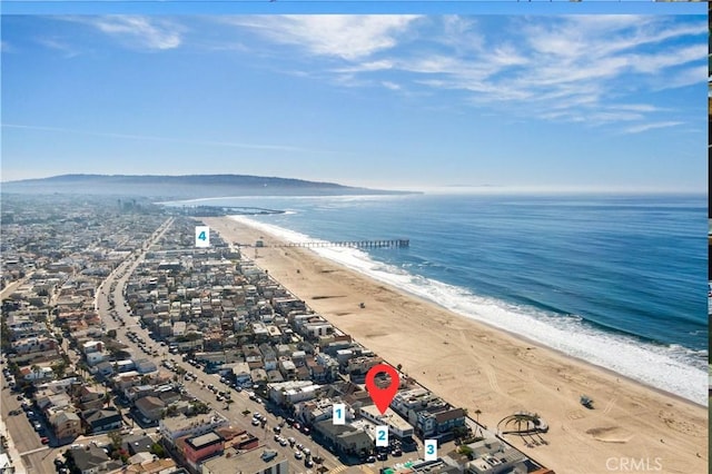 aerial view featuring a water view and a beach view