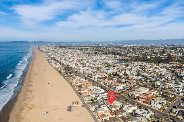 aerial view featuring a view of the beach and a water view