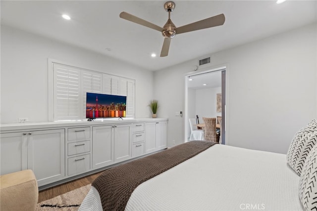 bedroom featuring wood-type flooring and ceiling fan