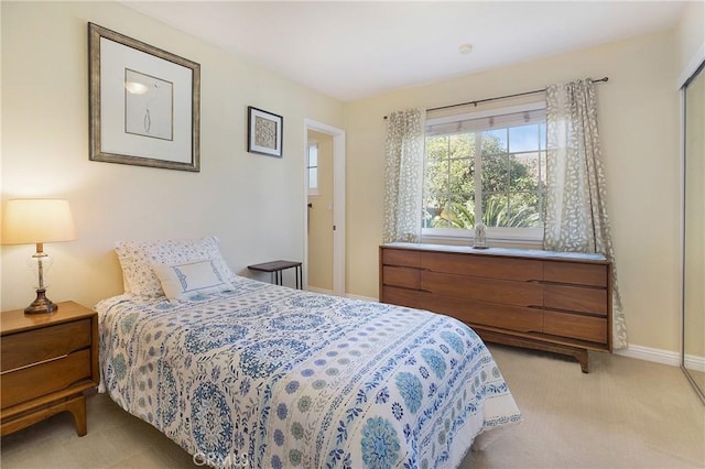 bedroom with light carpet