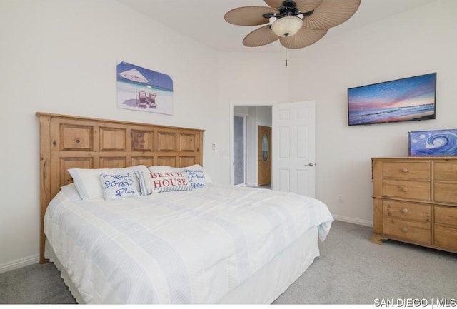 bedroom with light colored carpet and ceiling fan