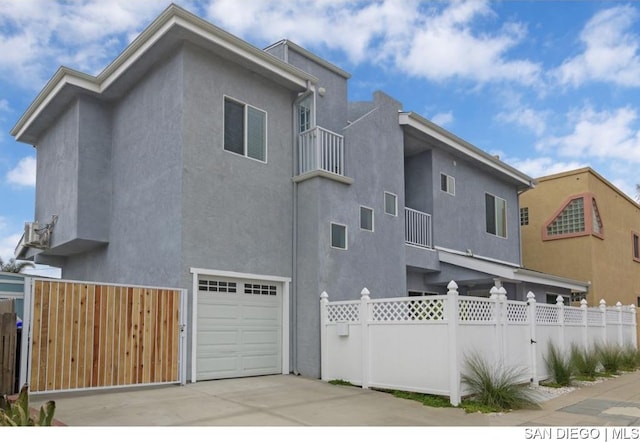 back of house with a garage