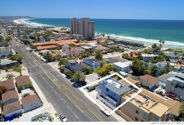 aerial view with a water view and a view of the beach