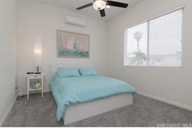 carpeted bedroom featuring a wall mounted air conditioner and ceiling fan