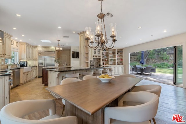 dining space with an inviting chandelier