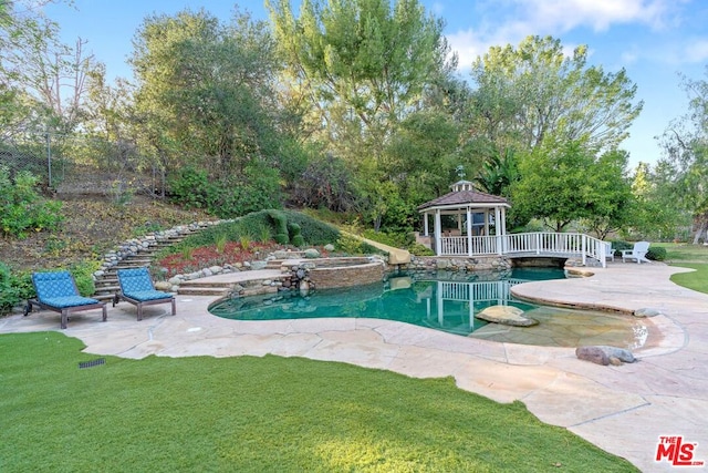 view of swimming pool with a yard, a gazebo, and a patio area